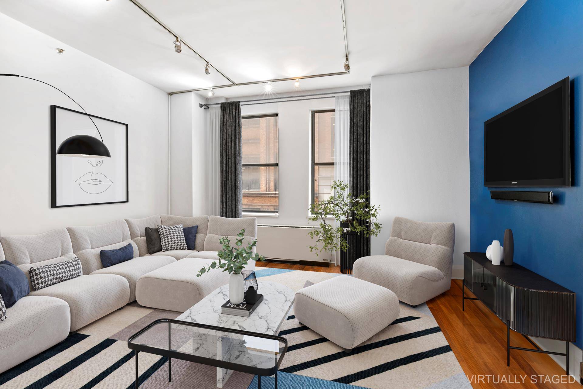 This gracious one bedroom loft features a generously proportioned living room perfect for entertaining, while the dual over sized windows and exposed metal beam adds New York charm and character.