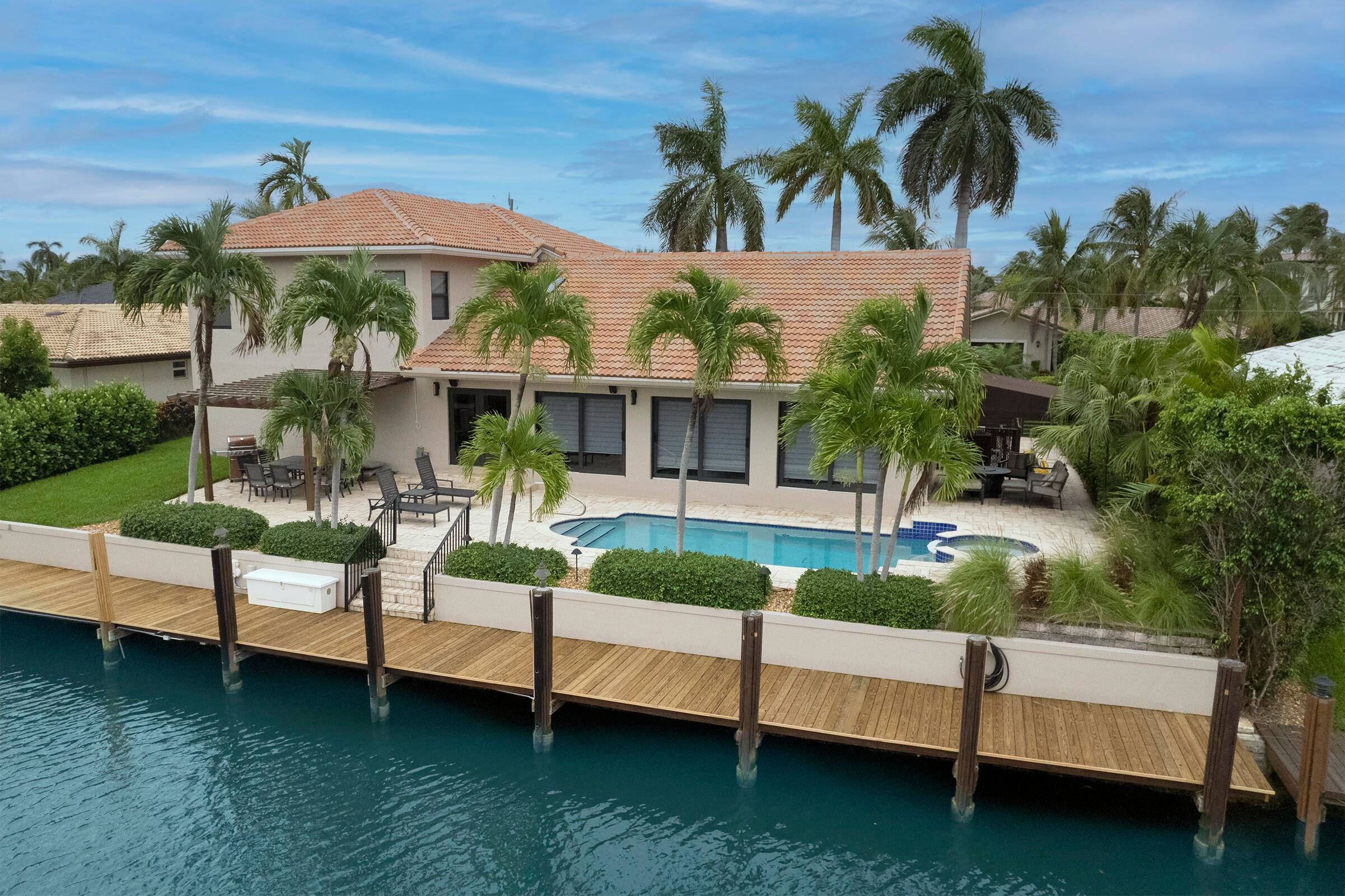 Located in desirable Venetian Isles Deepwater Estate featuring 90 feet of waterfrontage.