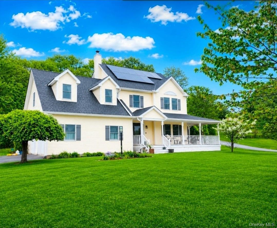 Inviting Colonial with wrap-around front Porch at the end of a cul-de-sac on over an acre