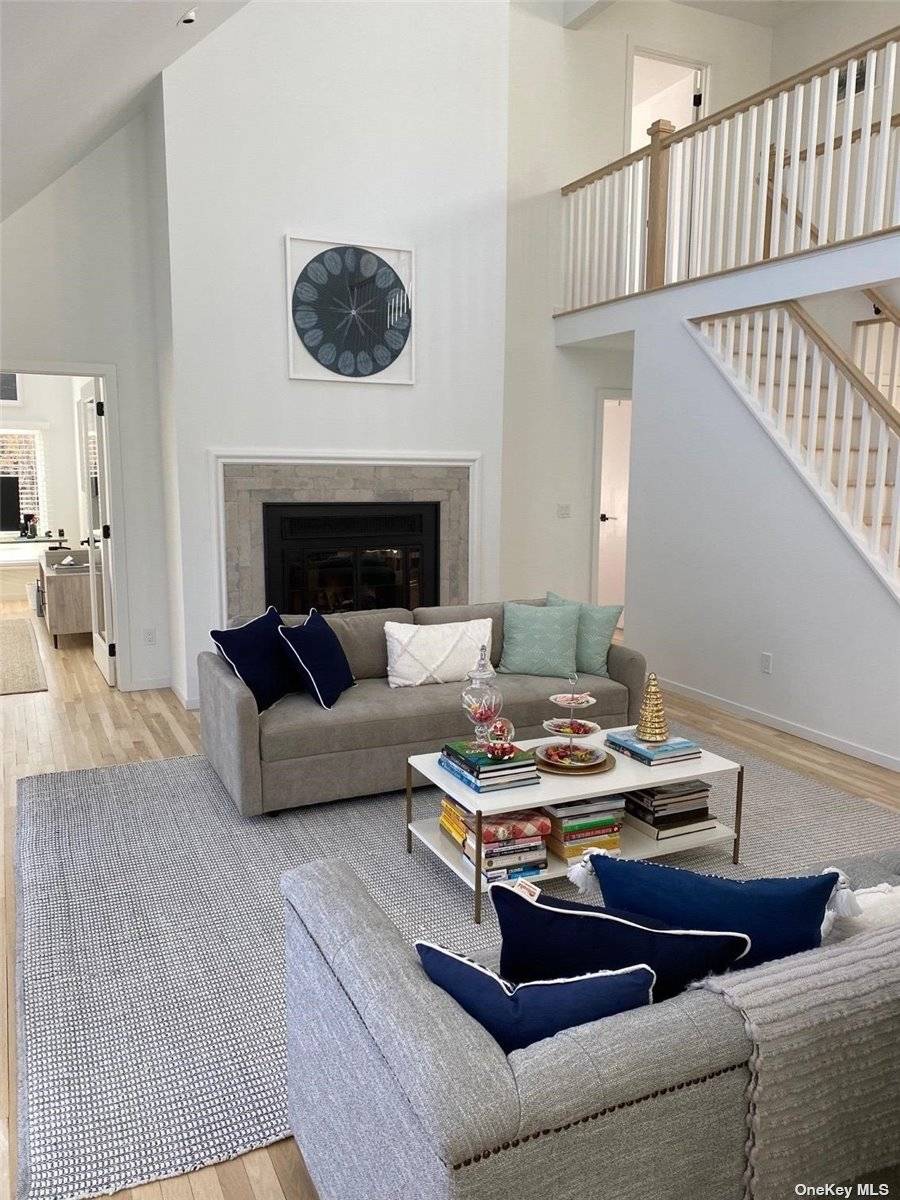 This completely renovated house sits on a park like acre on one of Quogue's quiet residential streets.