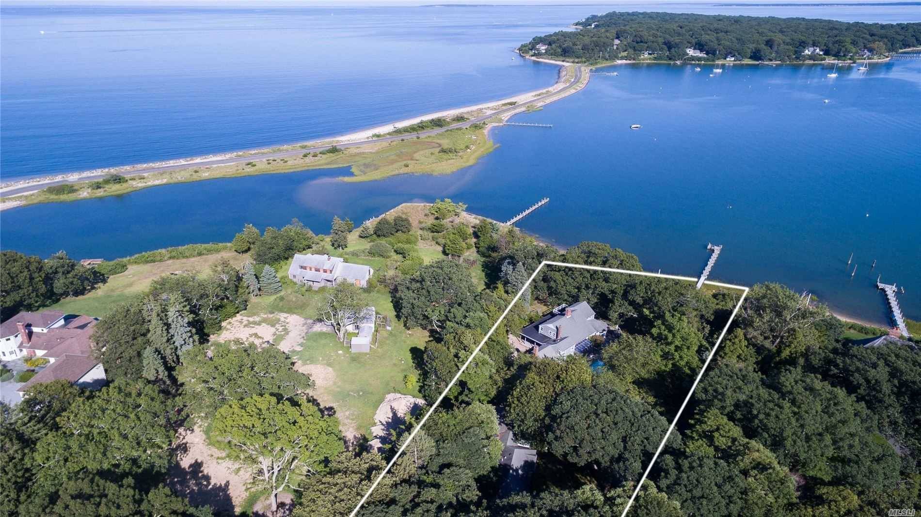 Stunning 2. 49 acre waterfront on Little Ram Island with main house, in ground waterside pool, 109' dock amp ; guest accessory living quarters w 2 car garage.