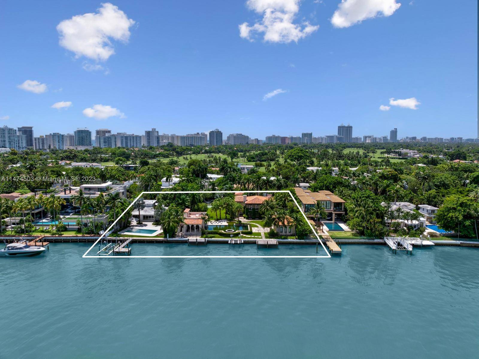 Embrace a rare opportunity on prestigious North Bay Road a triple lot encompassing 63, 376 SF with a total of 245 feet of prime waterfront.
