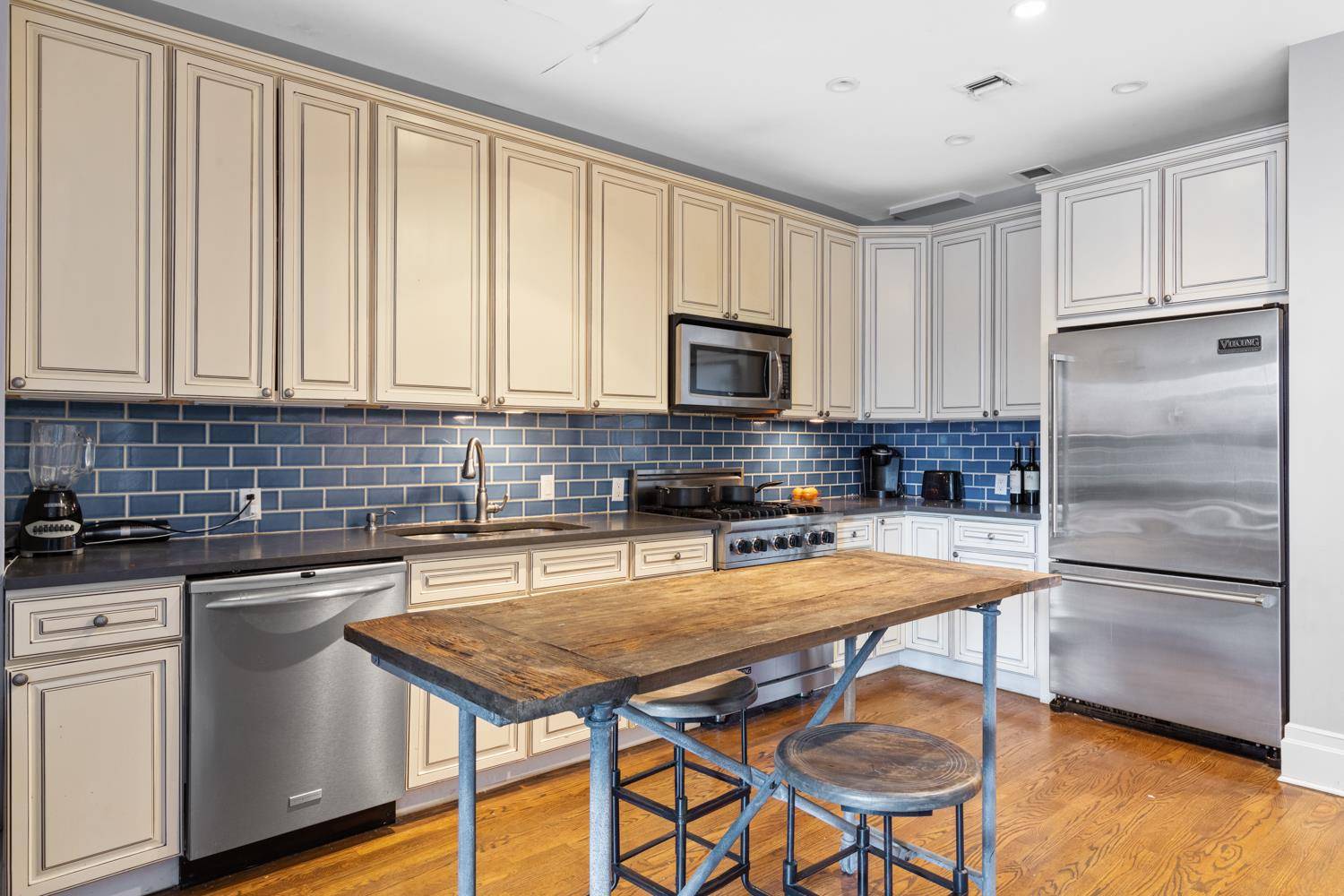 This beautiful brownstone condominium is located on a quiet tree lined street in a prime Manhattan location.
