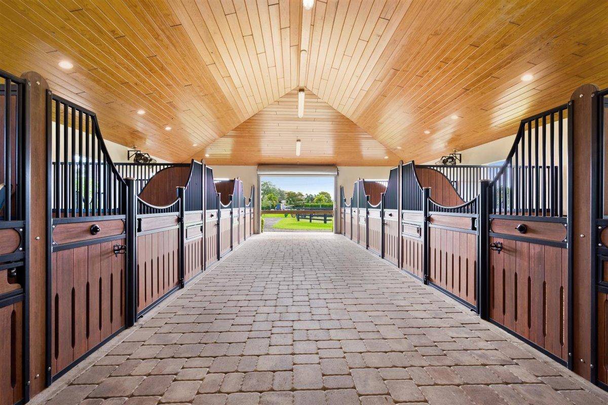 This striking 5. 7 acre equestrian estate in sought after Palm Beach Point is the perfect place to call home for your seasonal stay !