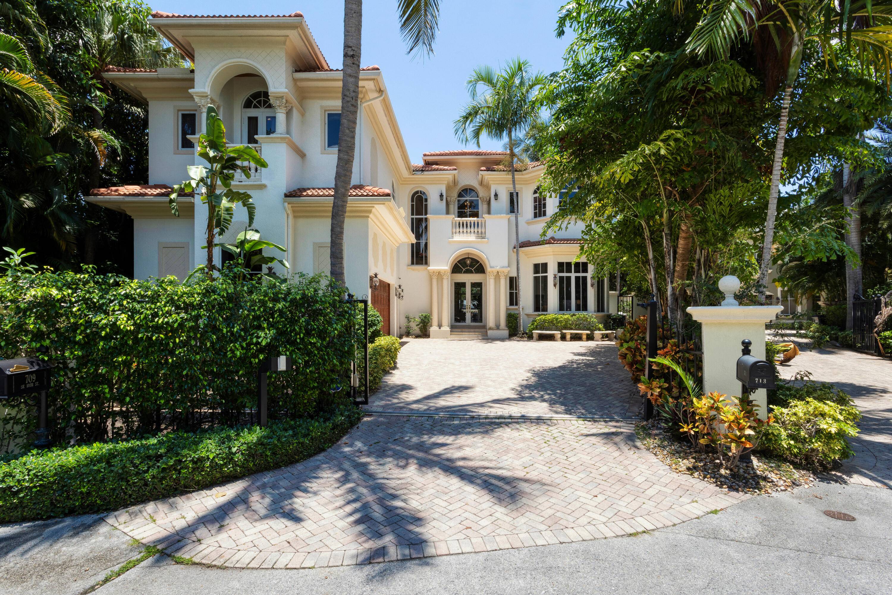 Imbued with elan, this six bedroom European inspired custom estate offers great Intracoastal views, an elevator, and two fireplaces, with one in the primary bathroom.