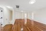 Second Floor Living Room with sliding doors to balcony deck with access to first floor patio
