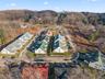Aerial perspective of suburban area with a heavily wooded area