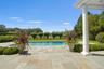 View of swimming pool featuring a patio area and a yard