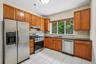 Tall Cherry Cabinetry & Granite Counters