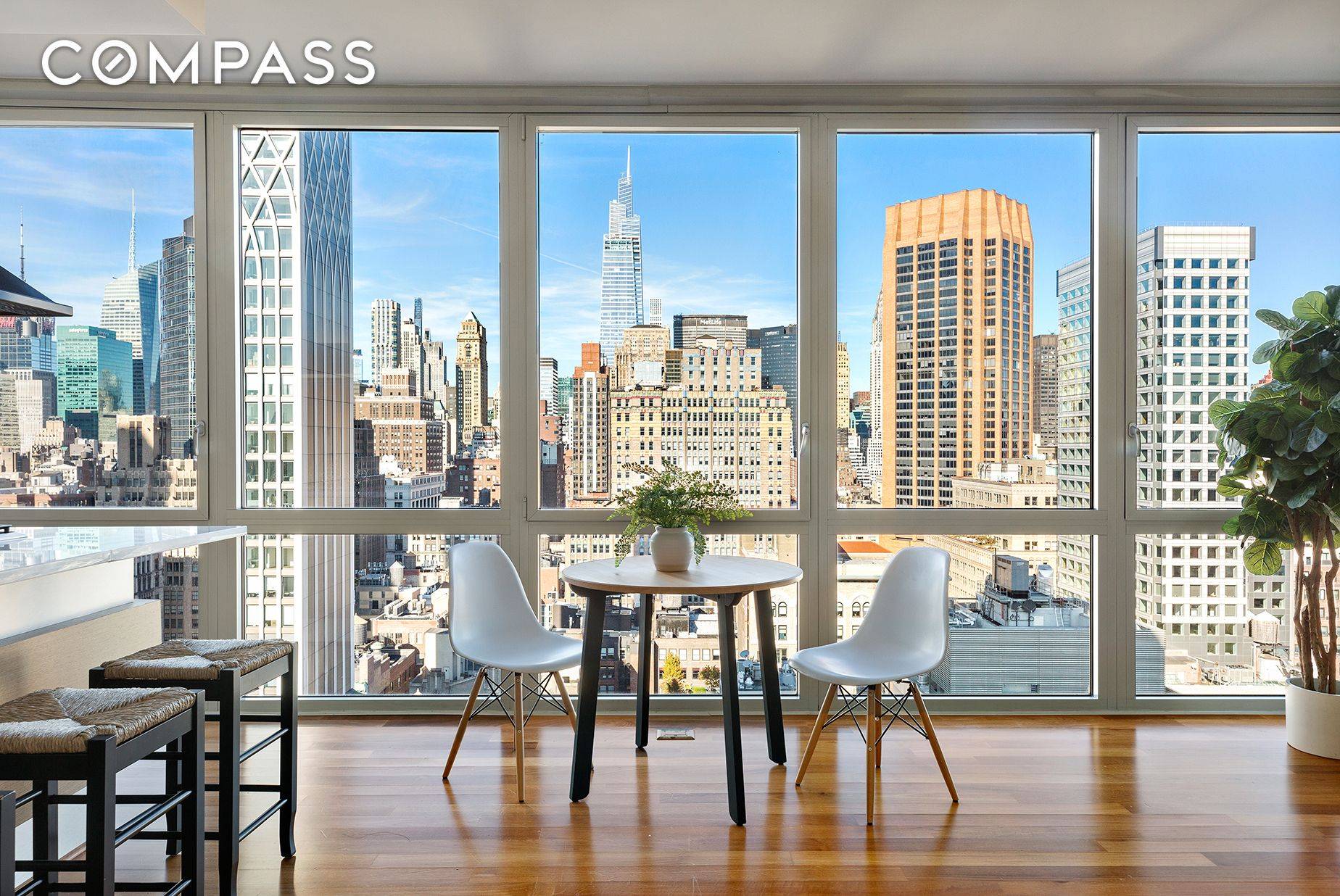 VIEWS, VIEWS, VIEWS. Chic modern one bedroom with floor to ceiling windows framing the MOST exquisite and iconic New York skyline views.