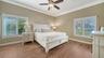 Primary bedroom with hardwood floors