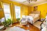 Bedroom featuring parquet flooring, radiator heating unit, crown molding, and a ceiling fan