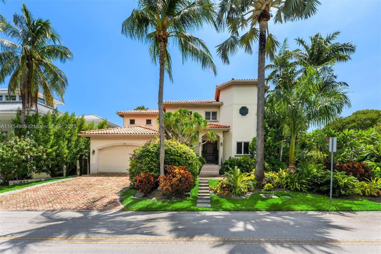 This elegant home is located on prestigious Harbor Drive in a corner lot surrounded by lush landscaping creating a serene private oasis.