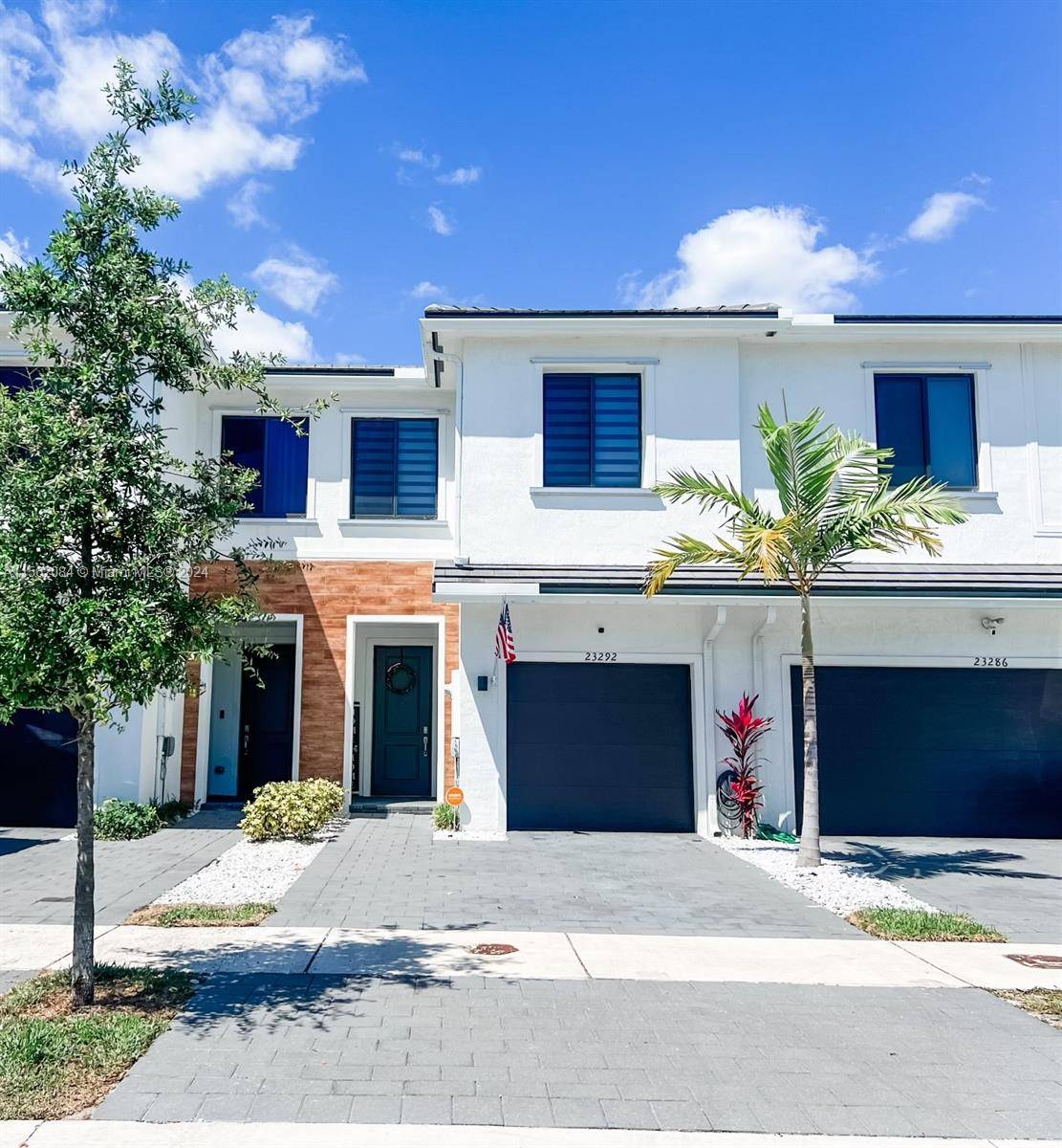 A contemporary townhouse, constructed in 2021, boasts three bedrooms, two full bathrooms, one half bathroom, and a single car garage in the desirable neighborhood of The Landings.