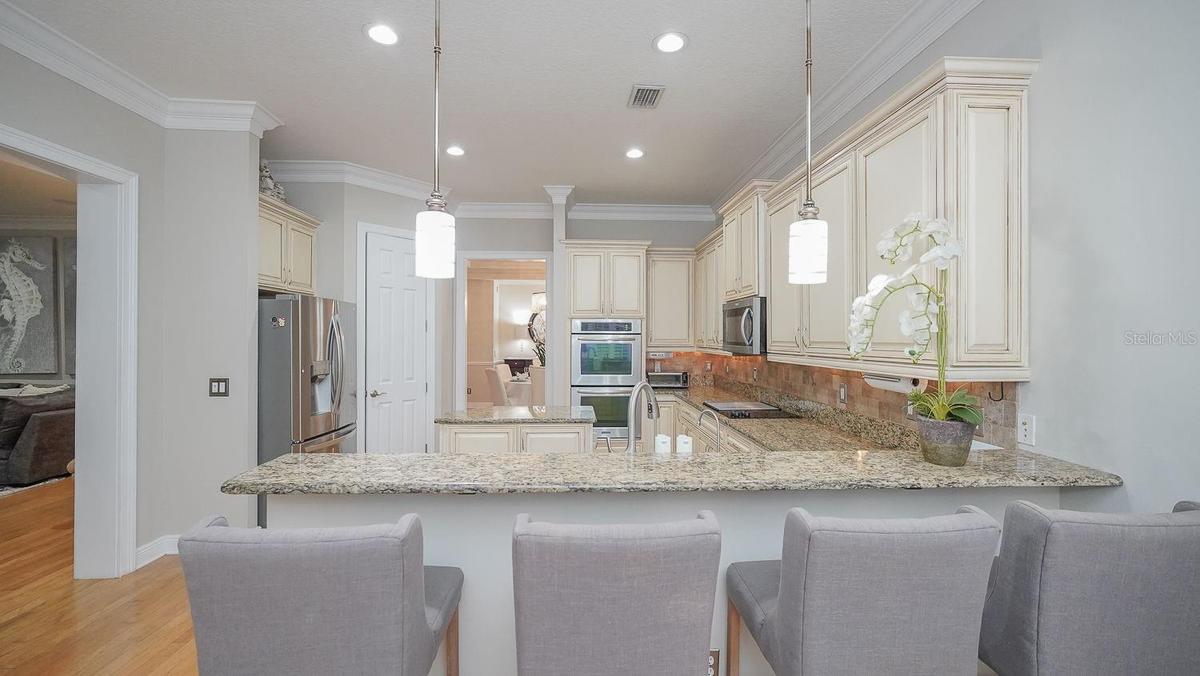 View from eat in area into large kitchen