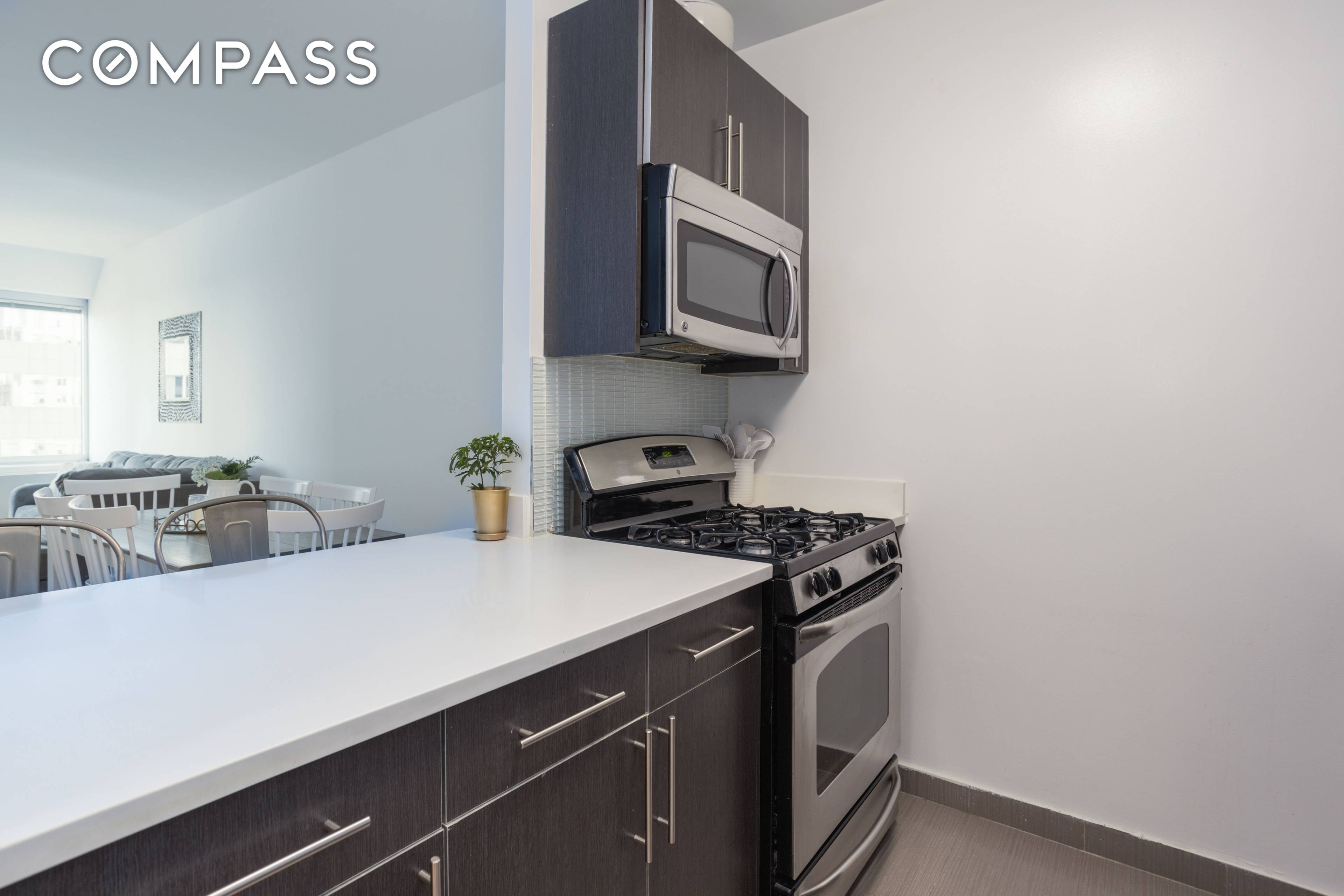 Spacious 900 sq ft one bedroom home office apartment offering plenty of natural light, 10' ceilings and spectacular views of East River and the Brooklyn Bridge.