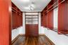 Primary closet — cherry wood built-ins