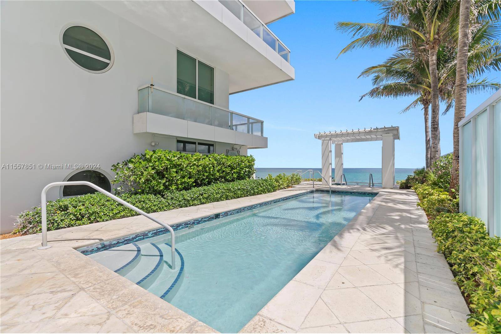 Embrace luxury living at the prestigious Fontainebleau resort in this oceanfront, furnished turnkey 5BD 6.