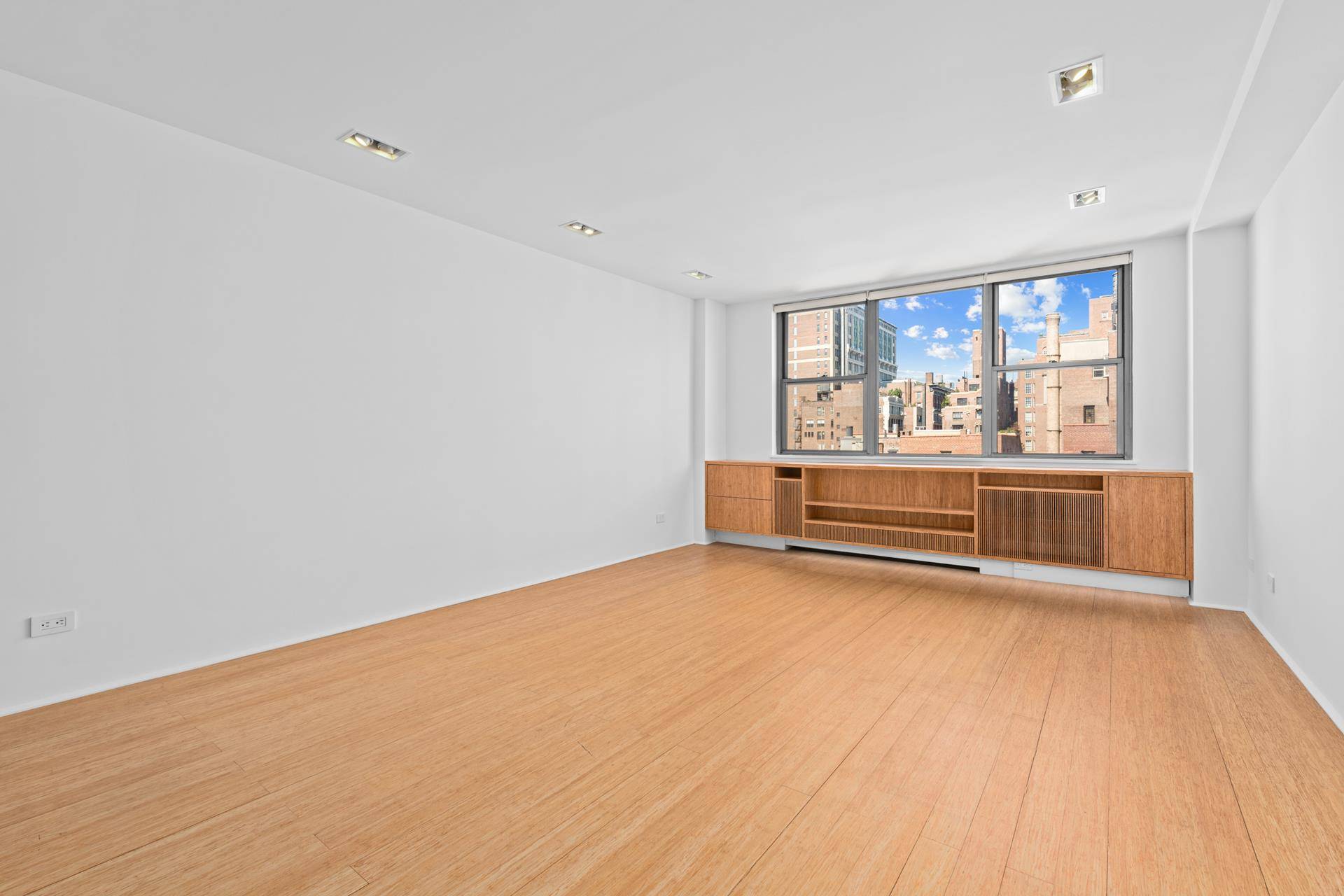 Jewel box apartment with full, open western views of the Midtown skyline and Gramercy Park, townhouse gardens and blue skies.