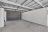 This oversized carport has plenty of room for a typical SUV with room to walk around the vehicle. It has lighting and an entrance door to the house. P
