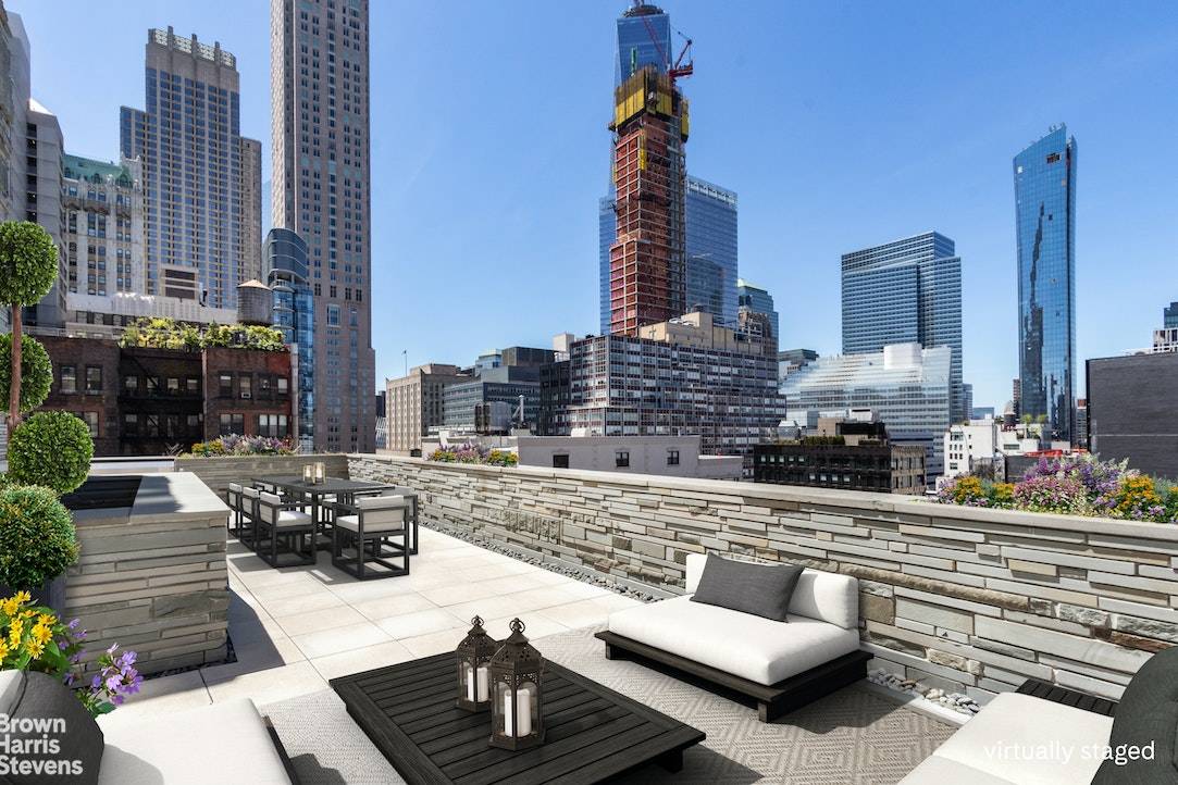 This chic full floor Penthouse boasts a huge private terrace, immaculate modern finishes, 10' ceilings, and approximately 2505 sq ft of interior space.