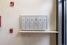 Detailed view of a fire alarm and mail area