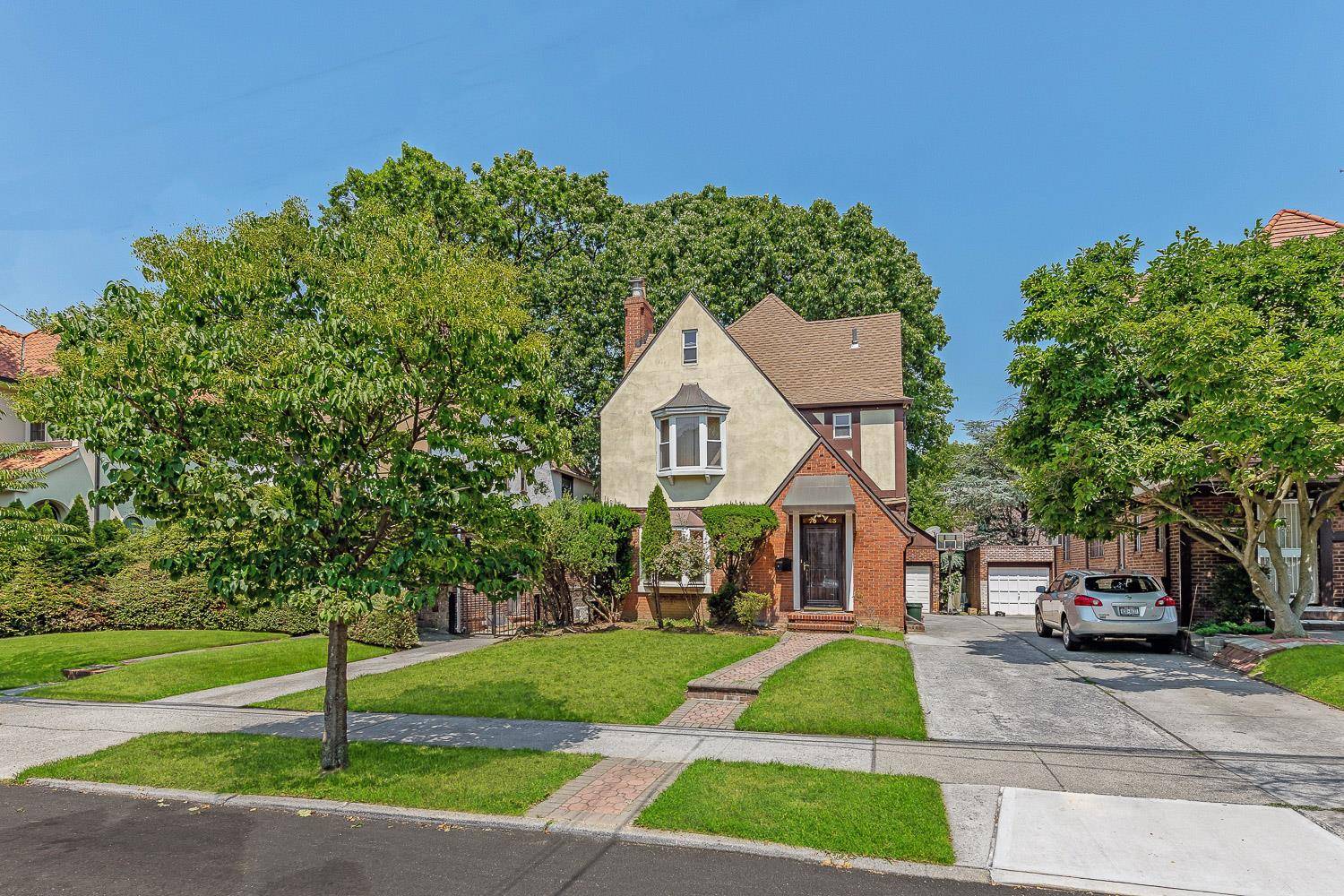 A Rare 2 Story detached Tudor home situated in the exclusive Van Court area of Forest Hills.