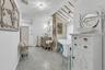 Bathroom with lofted ceiling, a stall shower, vanity, and a soaking tub