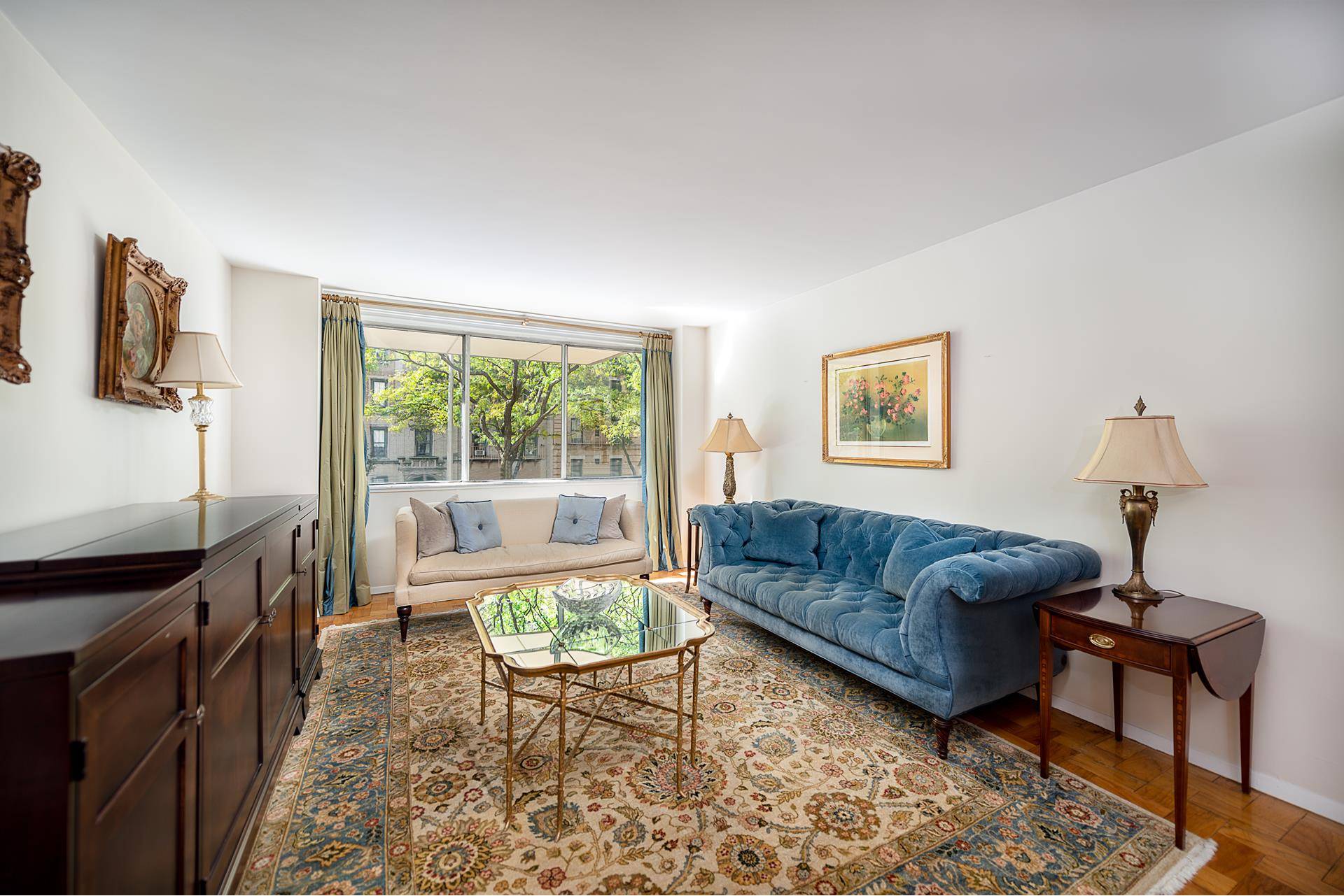 This sun filled quiet south facing apartment overlooking the beautiful tree lined 79th Street features 2 bedrooms, 2 baths, a powder room, and abundant closets throughout.