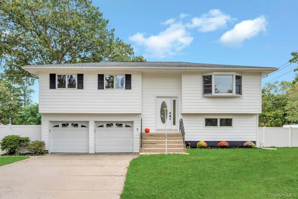 Beautifully Updated High Ranch with Unique Detached Garage amp ; Endless Possibilities !
