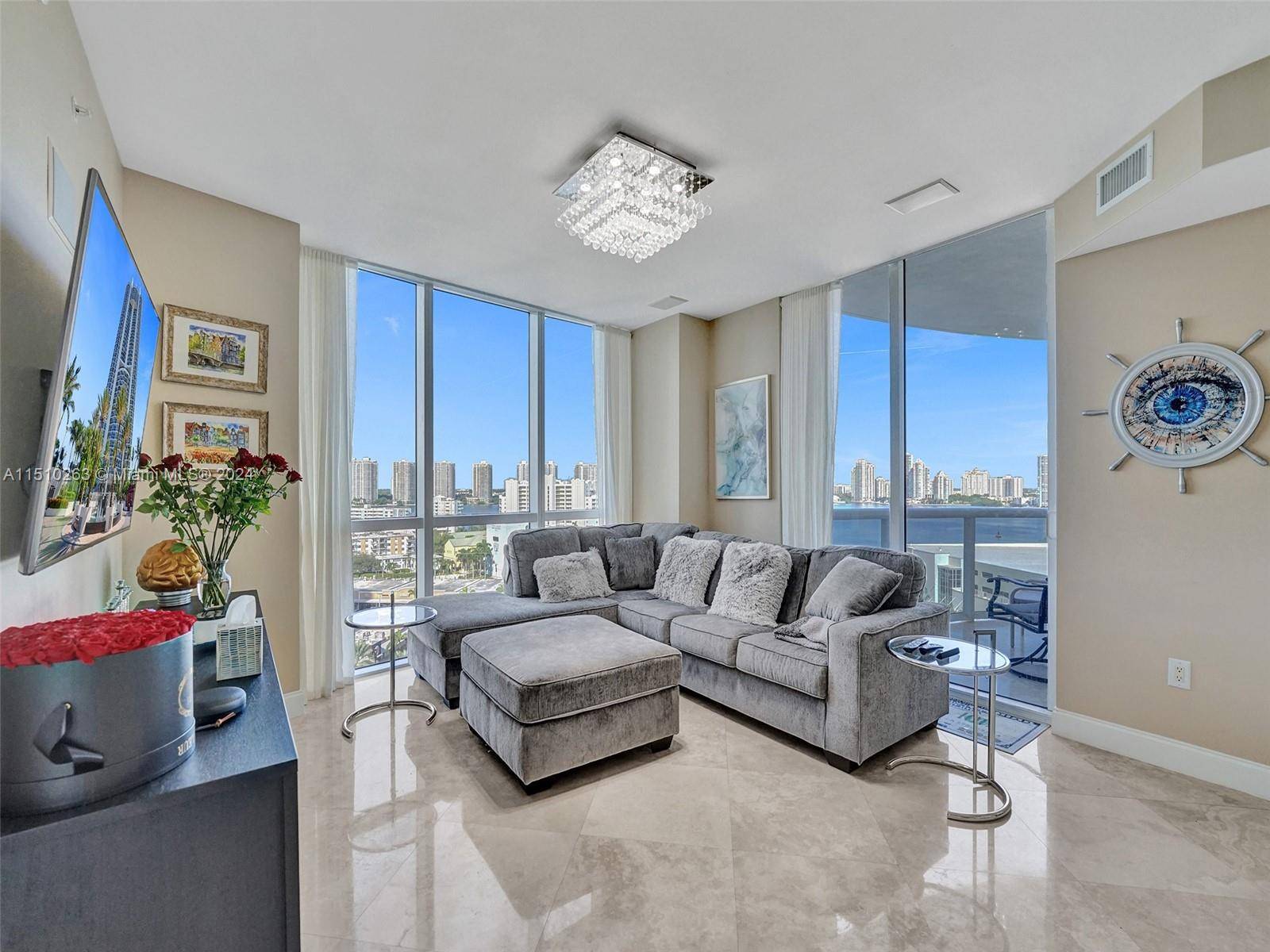 Upon entering this 2 bedroom, 2 bath unit in Trump Royale you are greeted by floor to ceiling windows that frame panoramic views of the city and Intracoastal Waterway.