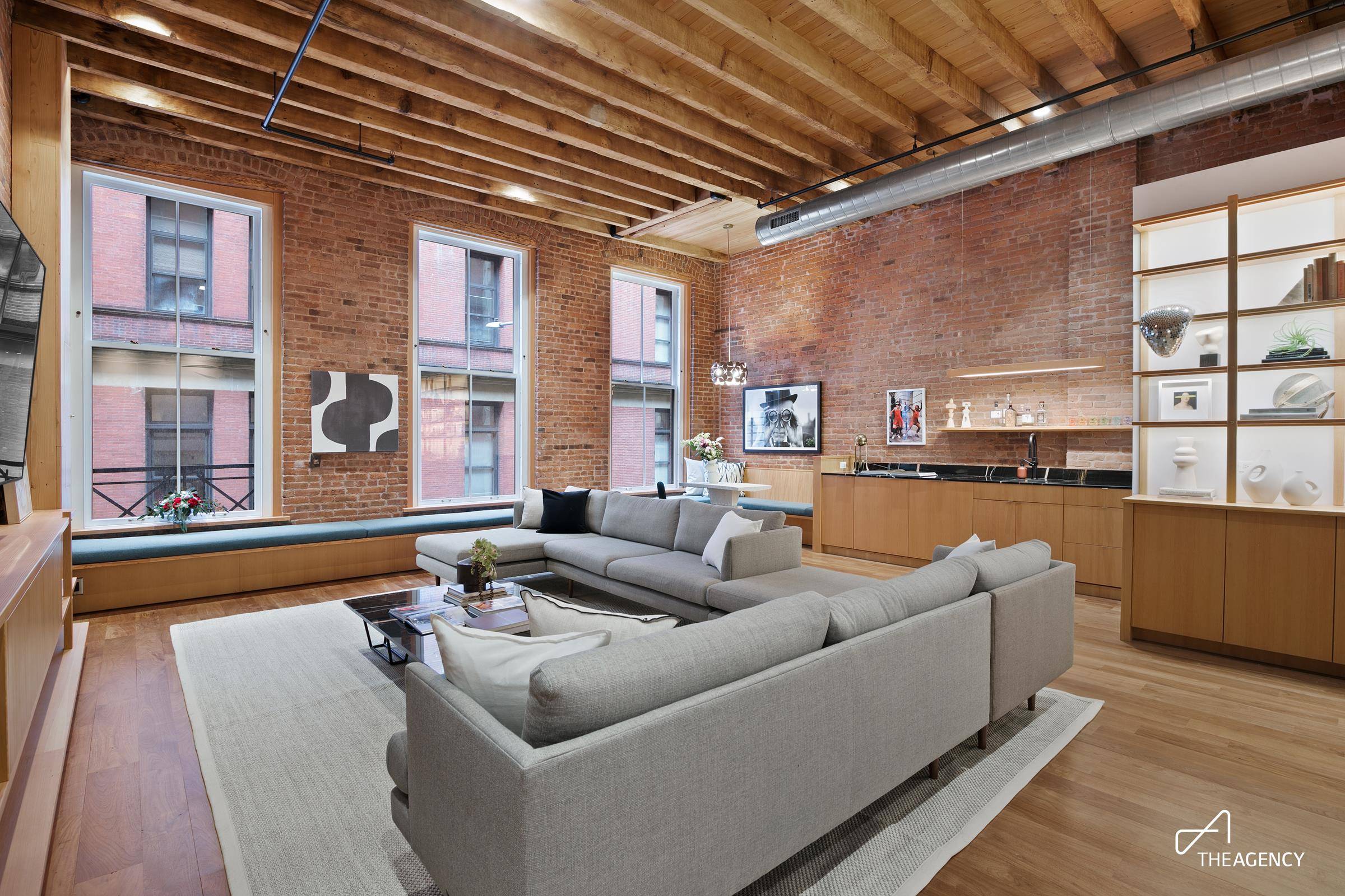 This exquisitely renovated and restored 4200 square foot duplex loft occupies two stories of a 5 story coop.