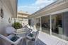 Wall of sliding glass doors to your private courtyard
