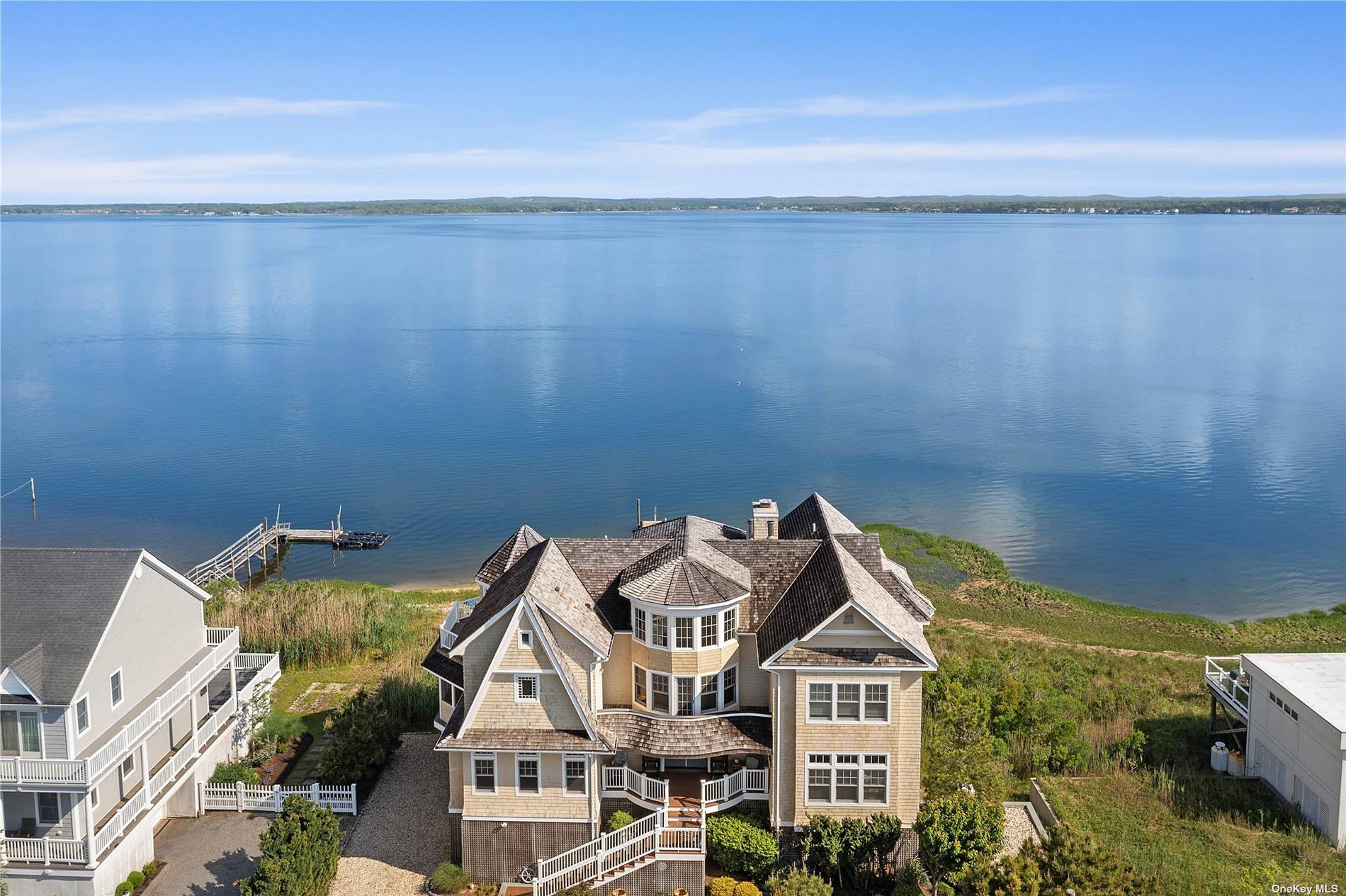 Directly on the bay, tucked away off the beaten path from Dune Road and with direct ocean right of way, there's a lot to love about this waterfront West Hampton ...