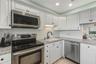 Complete with granite countertops, stainless steel appliances, and new LED canned lighting!