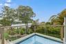View of pool with a water view