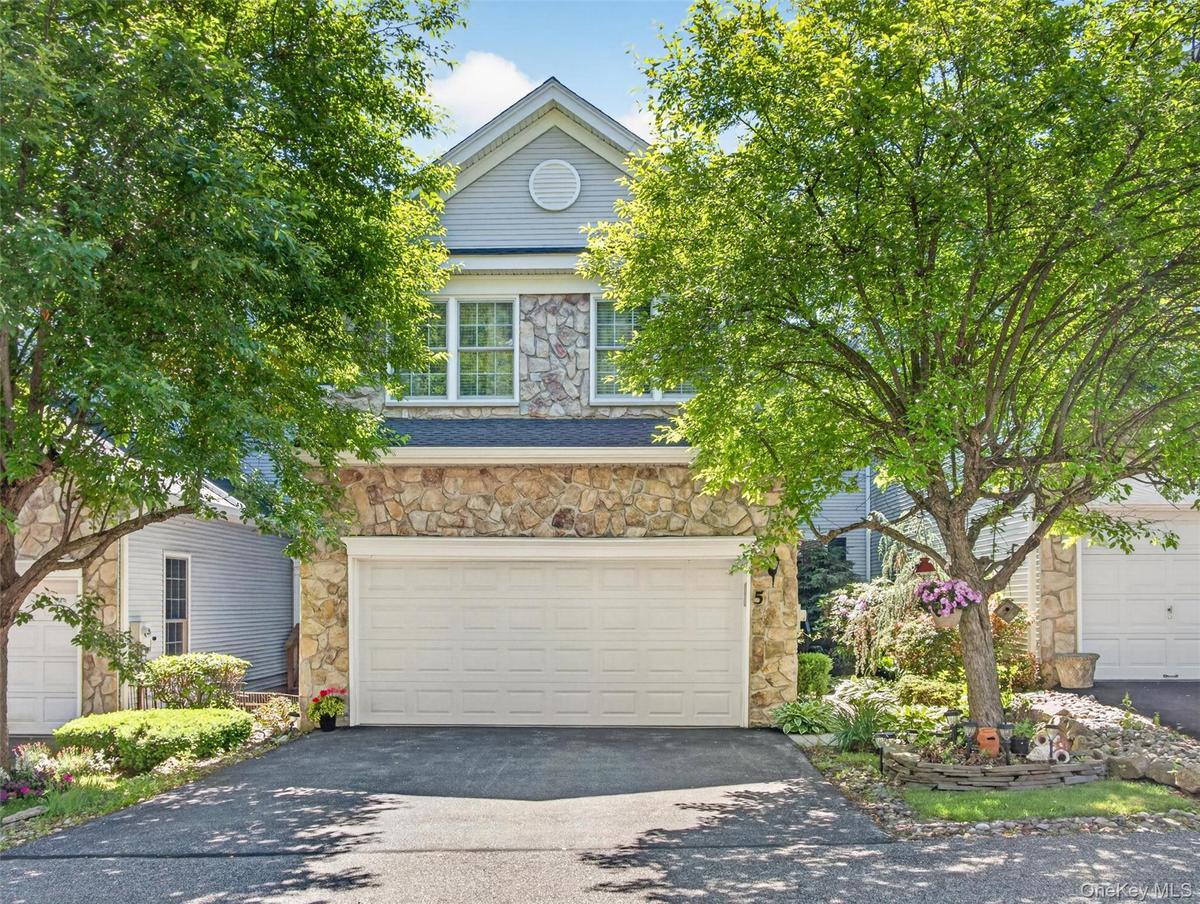 Double-wide garage, professional landscaping.