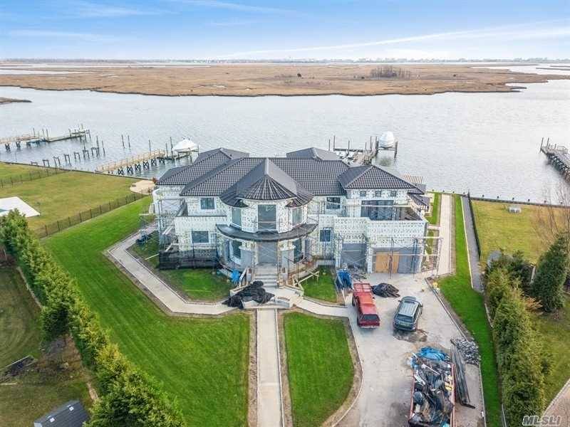 Magnificent new construction state of the art waterfront home.