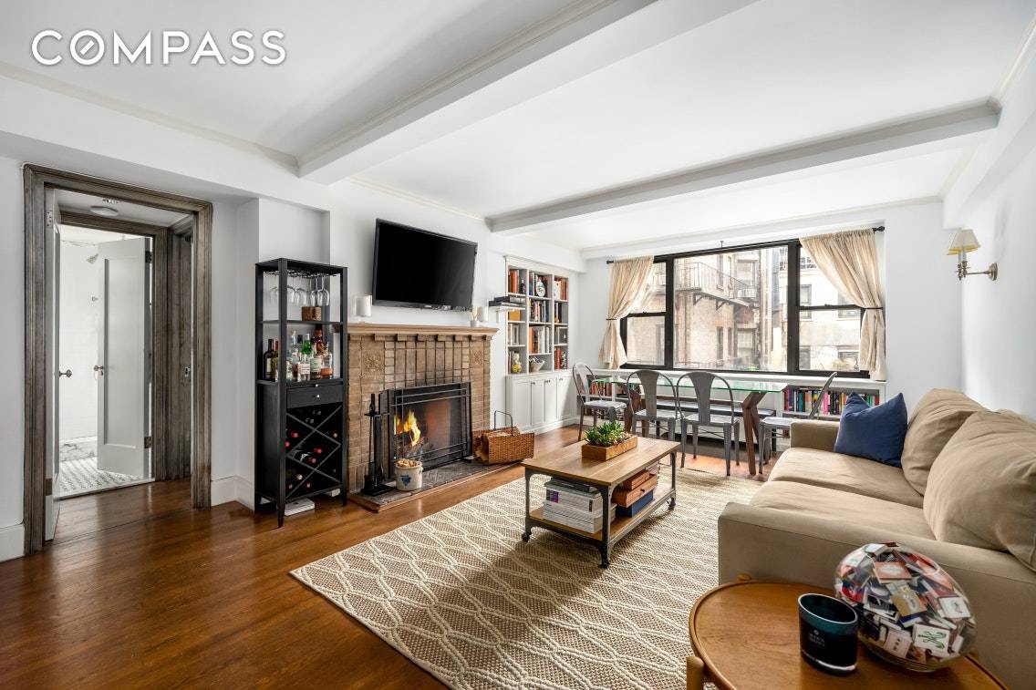 Elegant, light filled one bedroom apartment in the heart of the Greenwich Village Historic District, in an intimate prewar co op building with a wood burning fireplace !