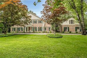 Located in desirable Mid Country Greenwich on 2 level acres with professionally landscaped gardens, a pristine pool a tennis court, this stately Colonial home offers both luxury and privacy.
