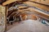 Spacious attic area offering storage and plywood flooring, and HVAC ductwork
