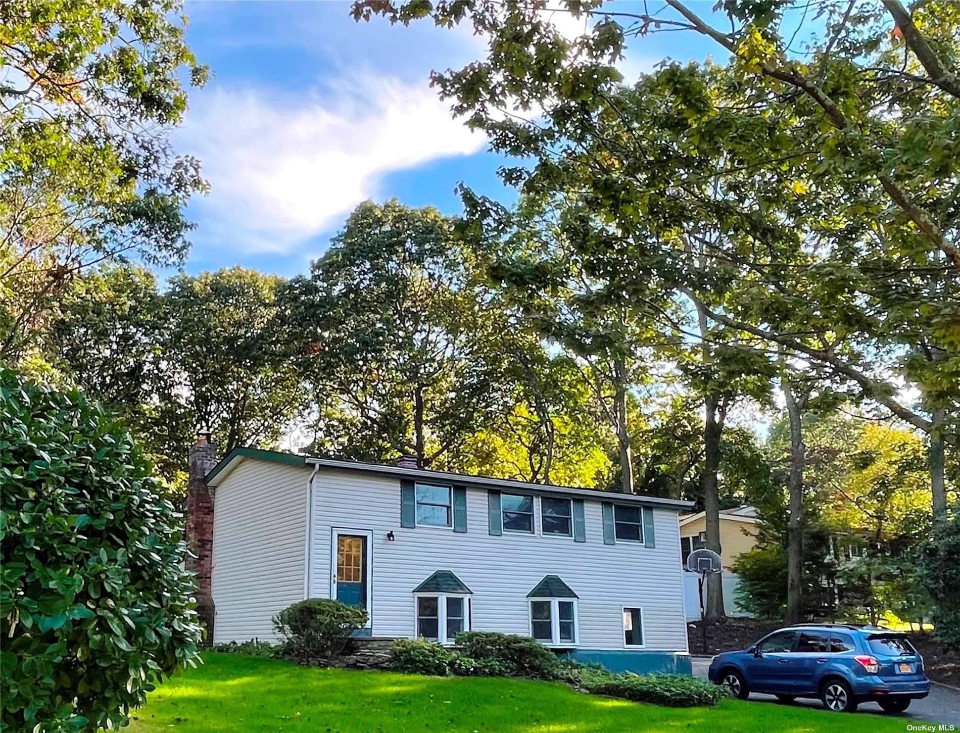 This newly renovated hi ranch home sits on a tree lined street in highly desirable in Three Village.