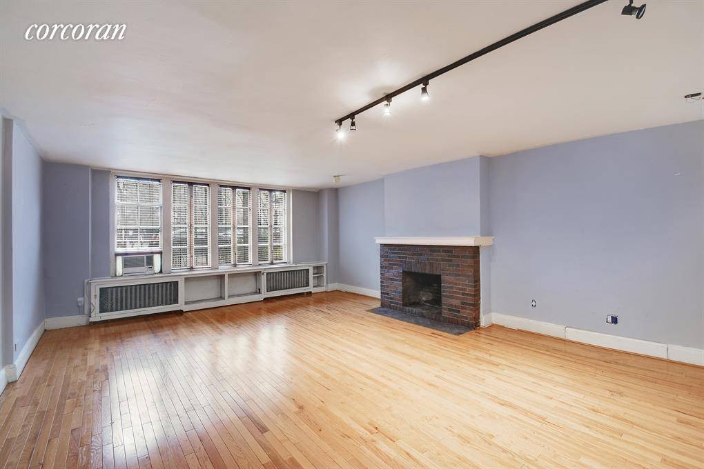 Enjoy full Gramercy Park views from this charming ground floor studio at 13 Gramercy Park South, located right next door to The National Arts Club.