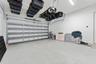 Attached 2-Car Garage with an epoxy-coated floor and built-in ceiling storage system