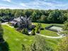 View from above of property with a forest