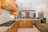 Gourmet Kitchen features a gas cooktop