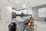 open concept kitchen with stainless steel appliances