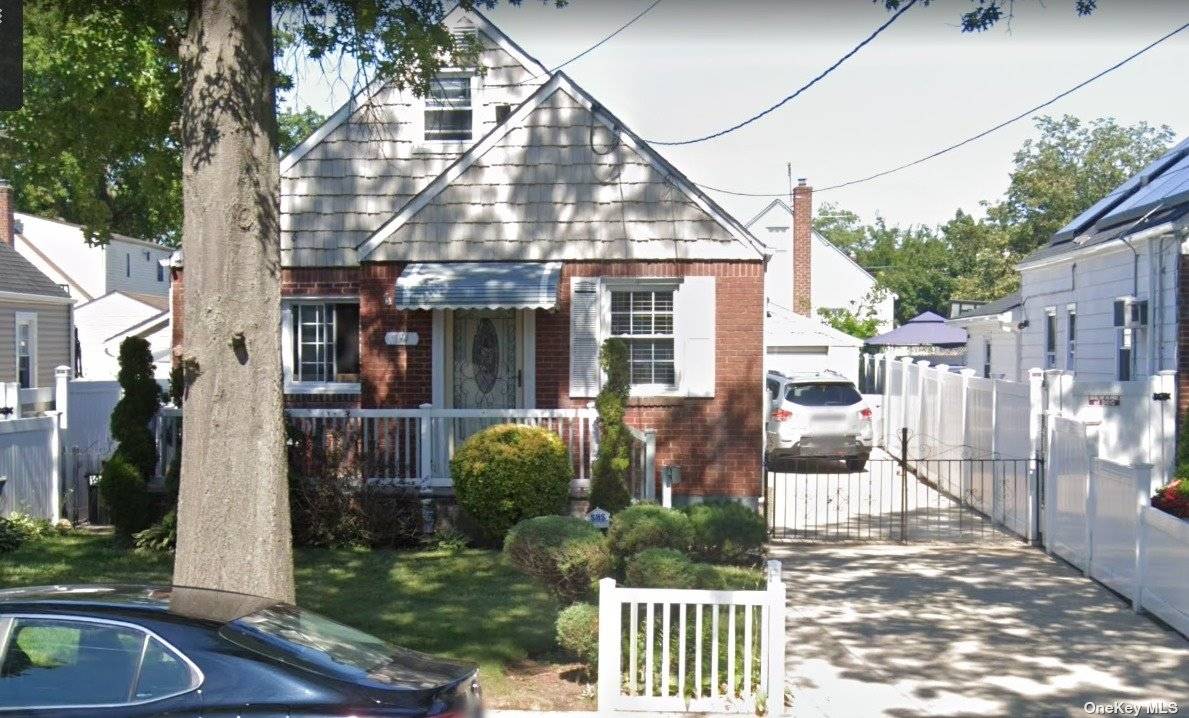 Beautiful Single Family Brick Cape House is sitting in the heart of Elmont.