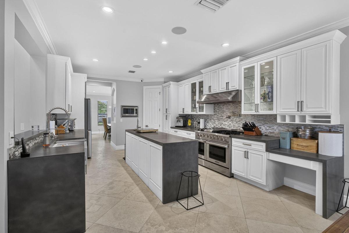 NO EXPENSE SPARED WITH THE TOP OF THE LINE THOR OVEN AND ALL ENERGY STAR APPLIANCES IN THIS CHEF'S KITCHEN.