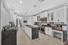 NO EXPENSE SPARED WITH THE TOP OF THE LINE THOR OVEN AND ALL ENERGY STAR APPLIANCES IN THIS CHEF'S KITCHEN.